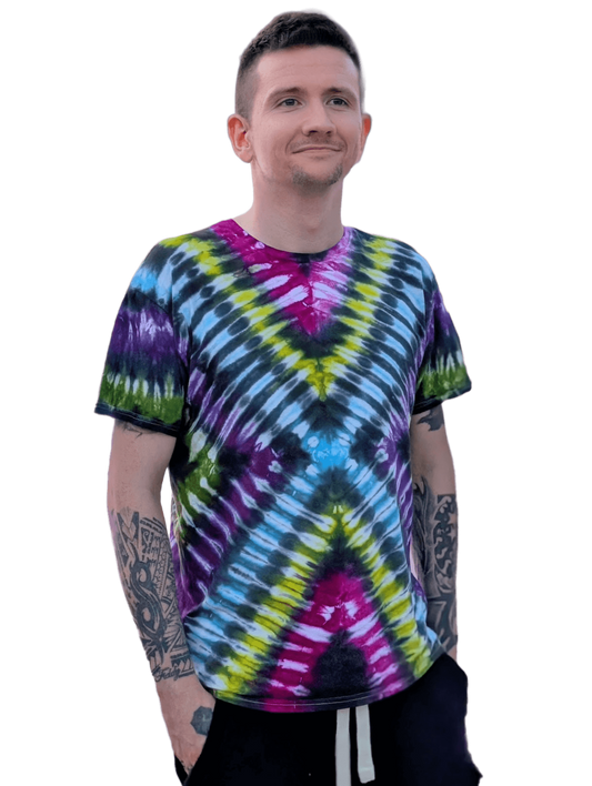 Person wearing a tie-dye shirt with a black background