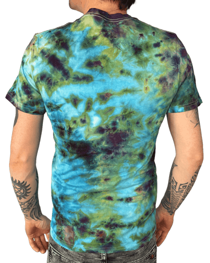 Model wearing hand-dyed turquoise and green camo tie-dye T-shirt for alternative fashion lovers