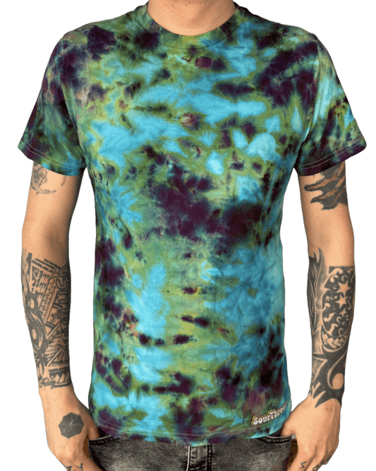 Model wearing hand-dyed turquoise and green camo tie-dye T-shirt for alternative fashion lovers